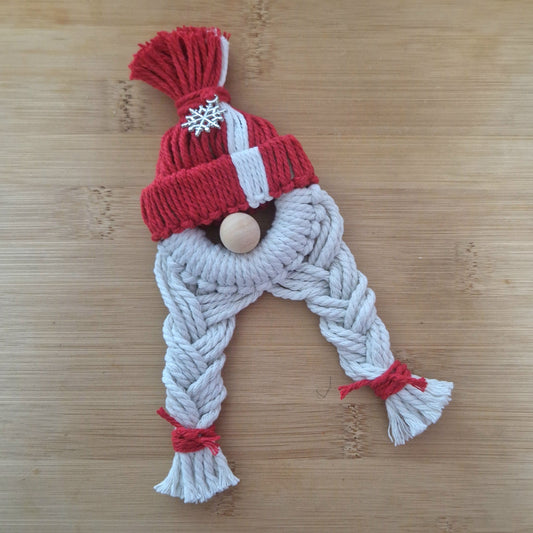 Red macrame wall hanging doll