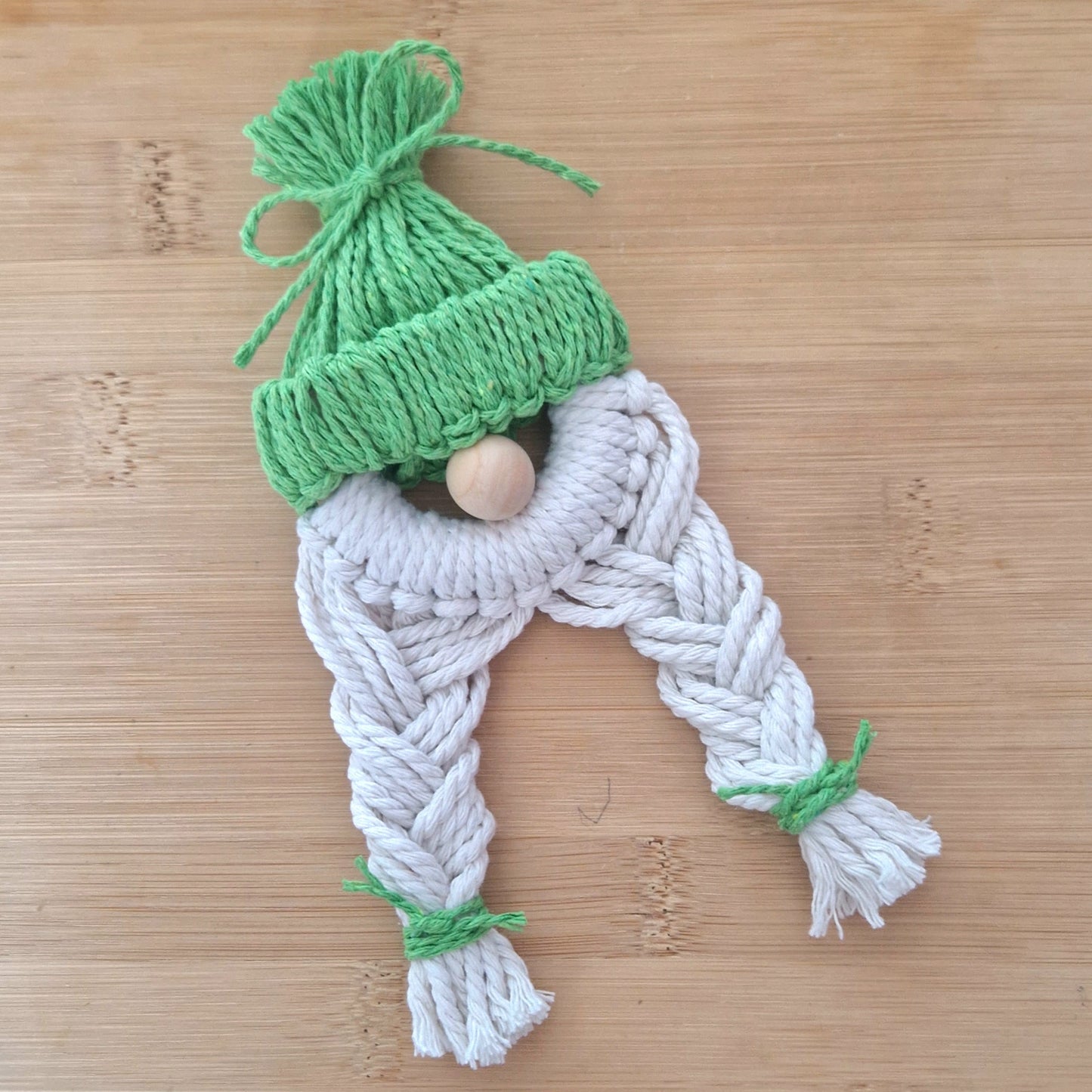 Green macrame wall hanging doll