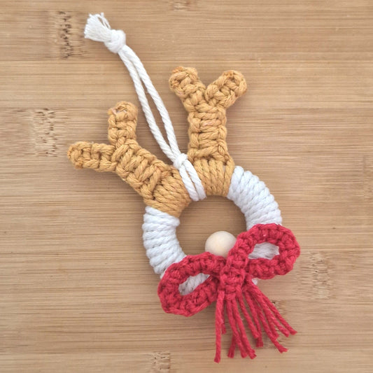 Red macrame wall hanging reindeer