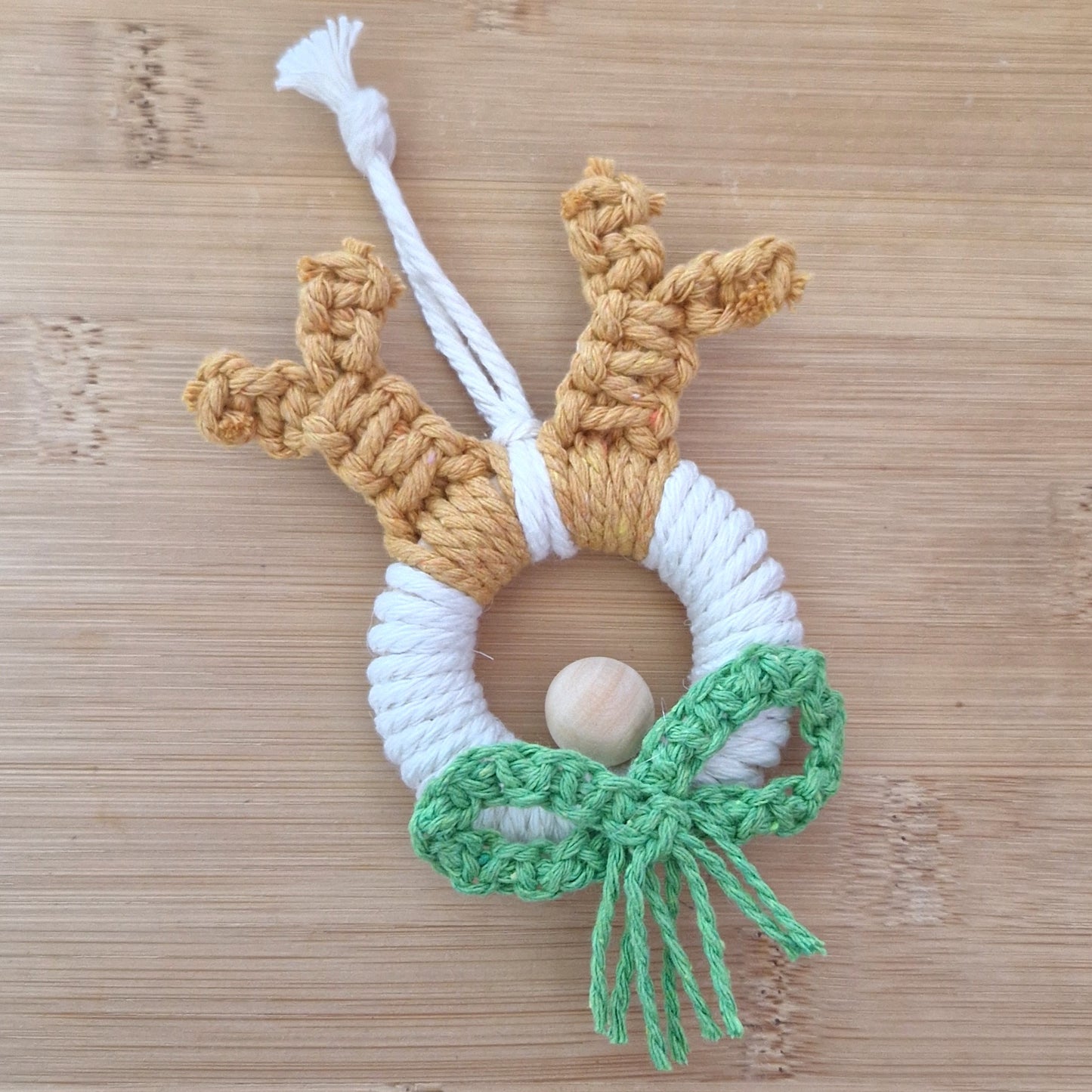 Green macrame wall hanging reindeer