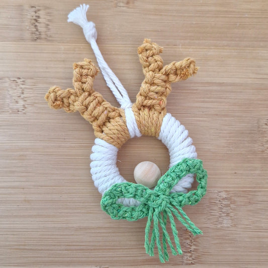 Green macrame wall hanging reindeer