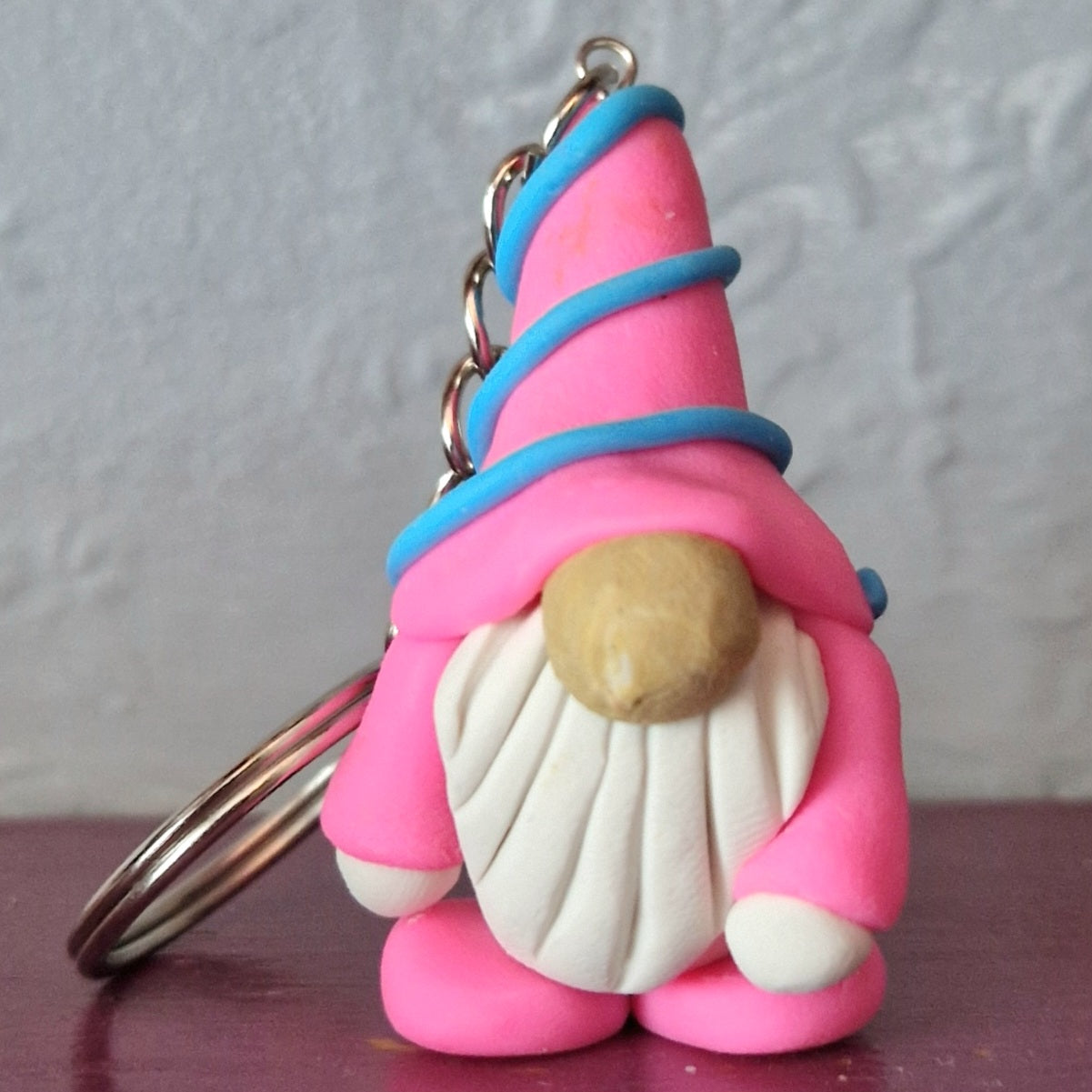 Neon pink cute gonk keyring